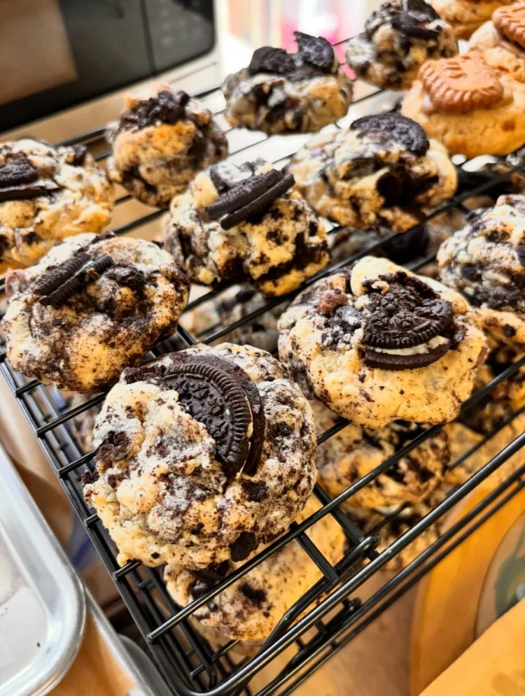 Cookies and cream cookies cooling on a bakery rack