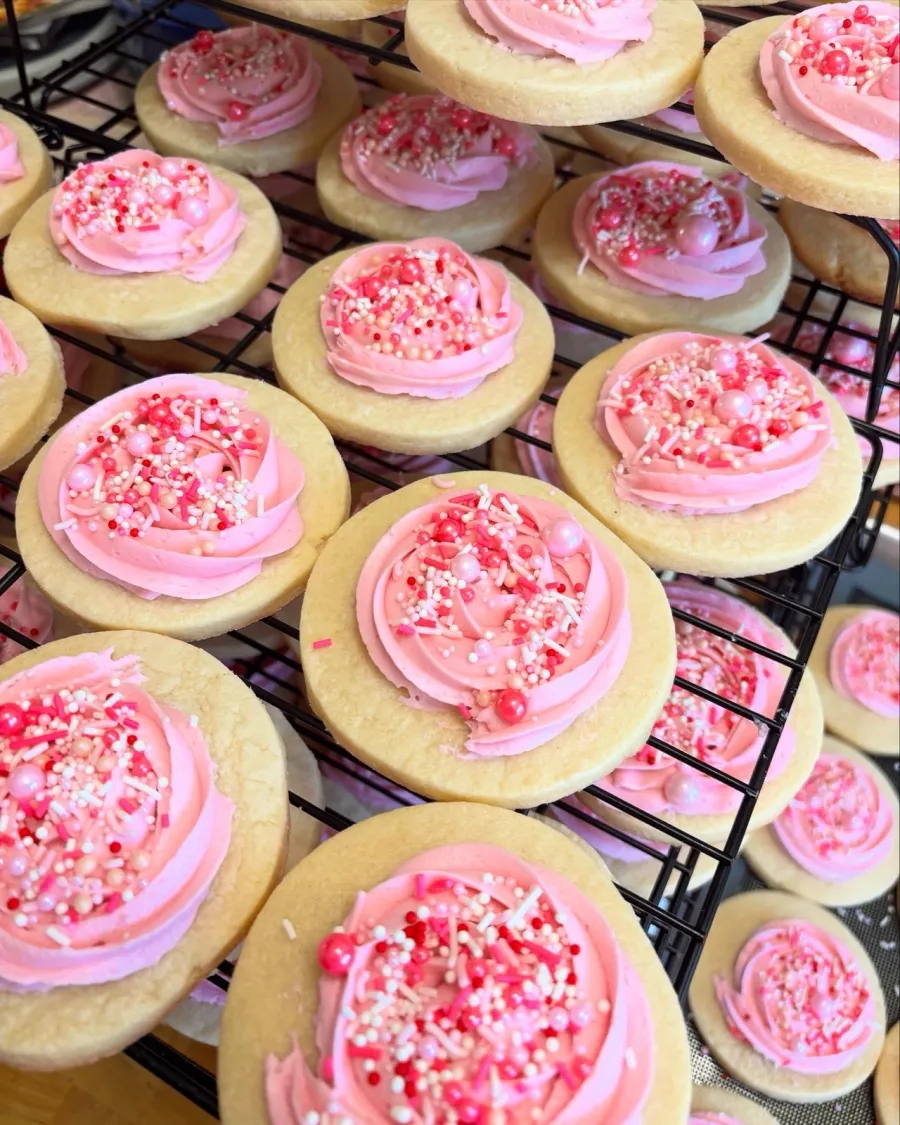 Pink floral sugar cookies prepared for a custom event order