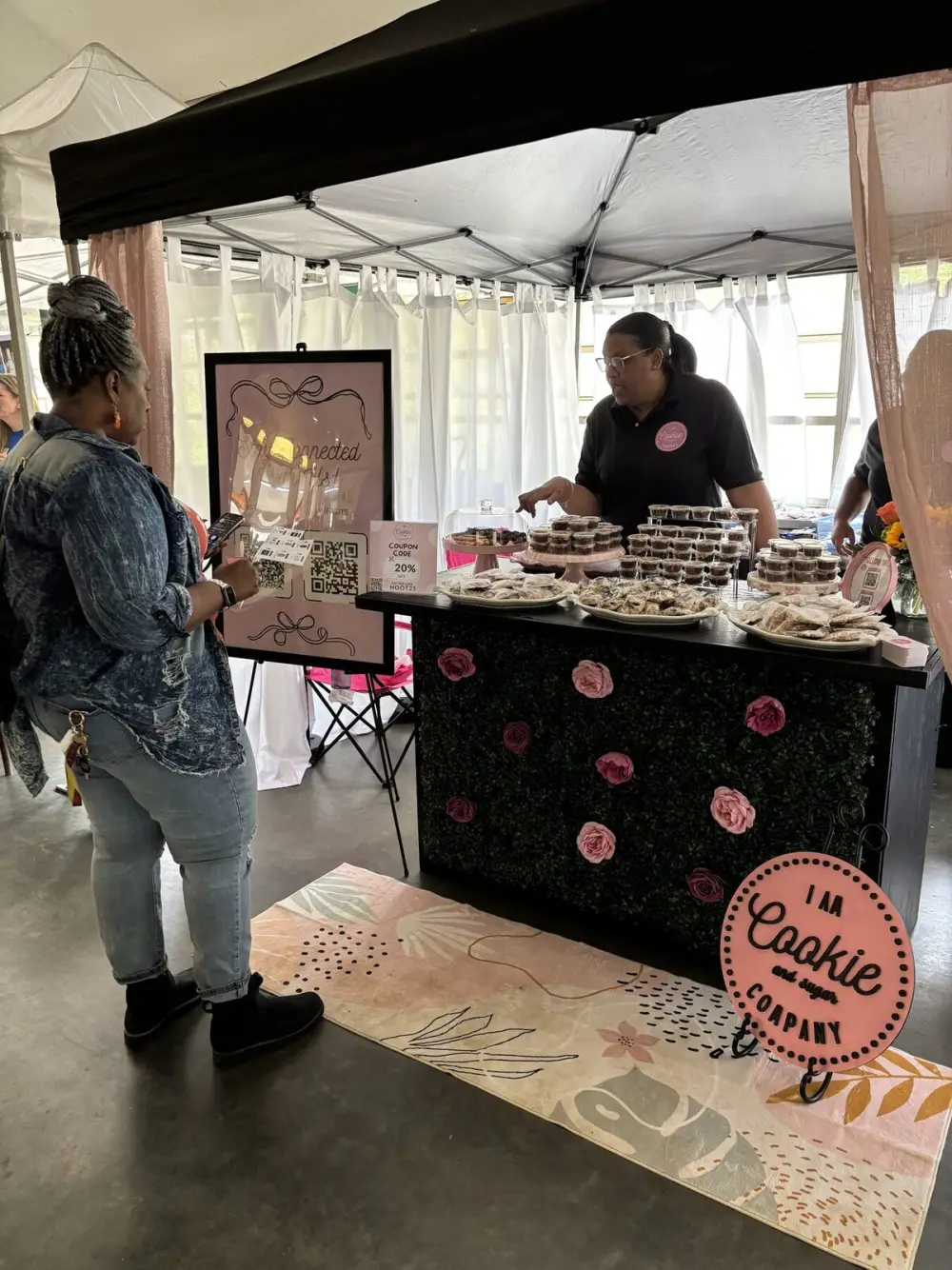 I Am Cookie and Sugar Co. treats displayed at an outdoor market